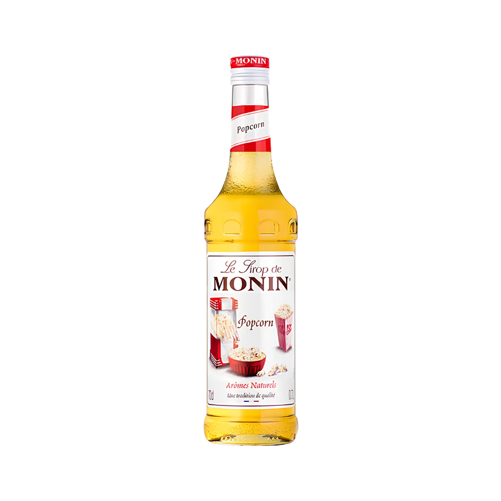 Бутилка Monin сироп пуканки (Popcorn) 700 мл със златист сироп и червено-бяла капачка на бял фон